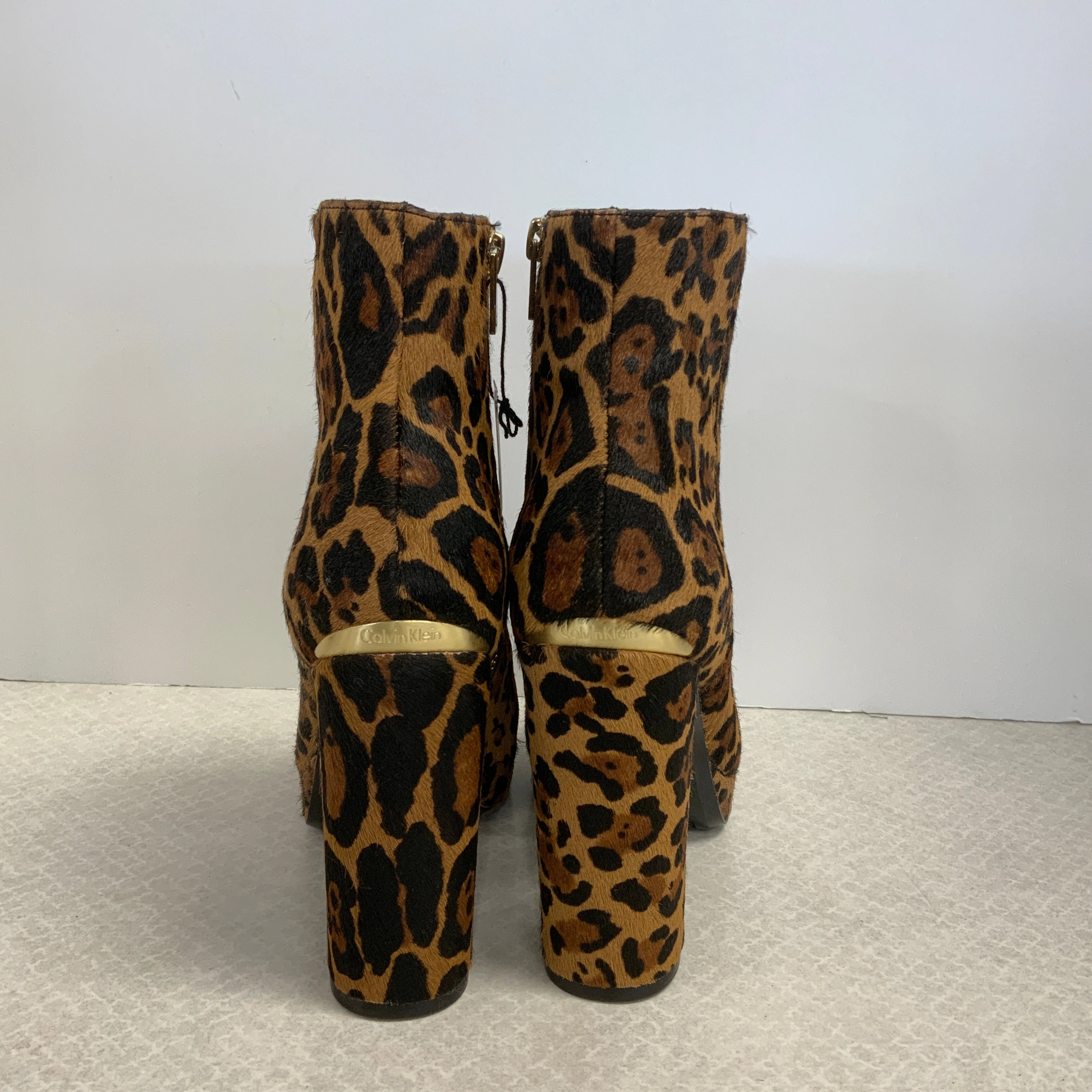 Boots Ankle Heels By Calvin Klein In Animal Print, Size: 7